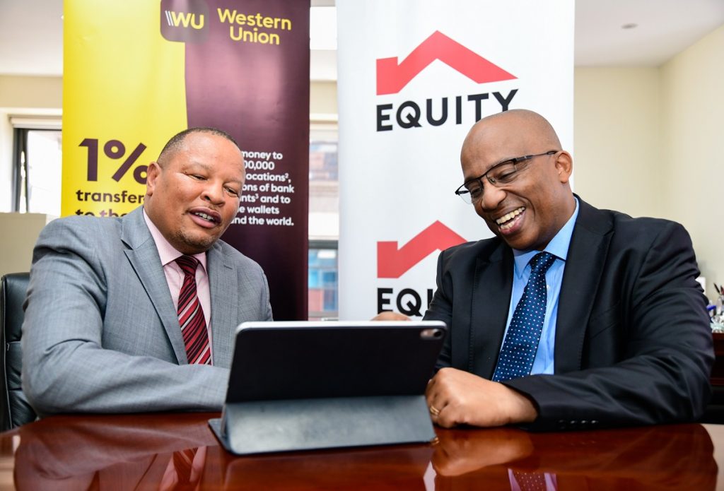 Equity Group Robert Kiboti (right) and Equity Bank Kenya Managing Director Gerald Warui